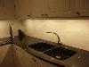 Kitchen bench with granite and marble facing